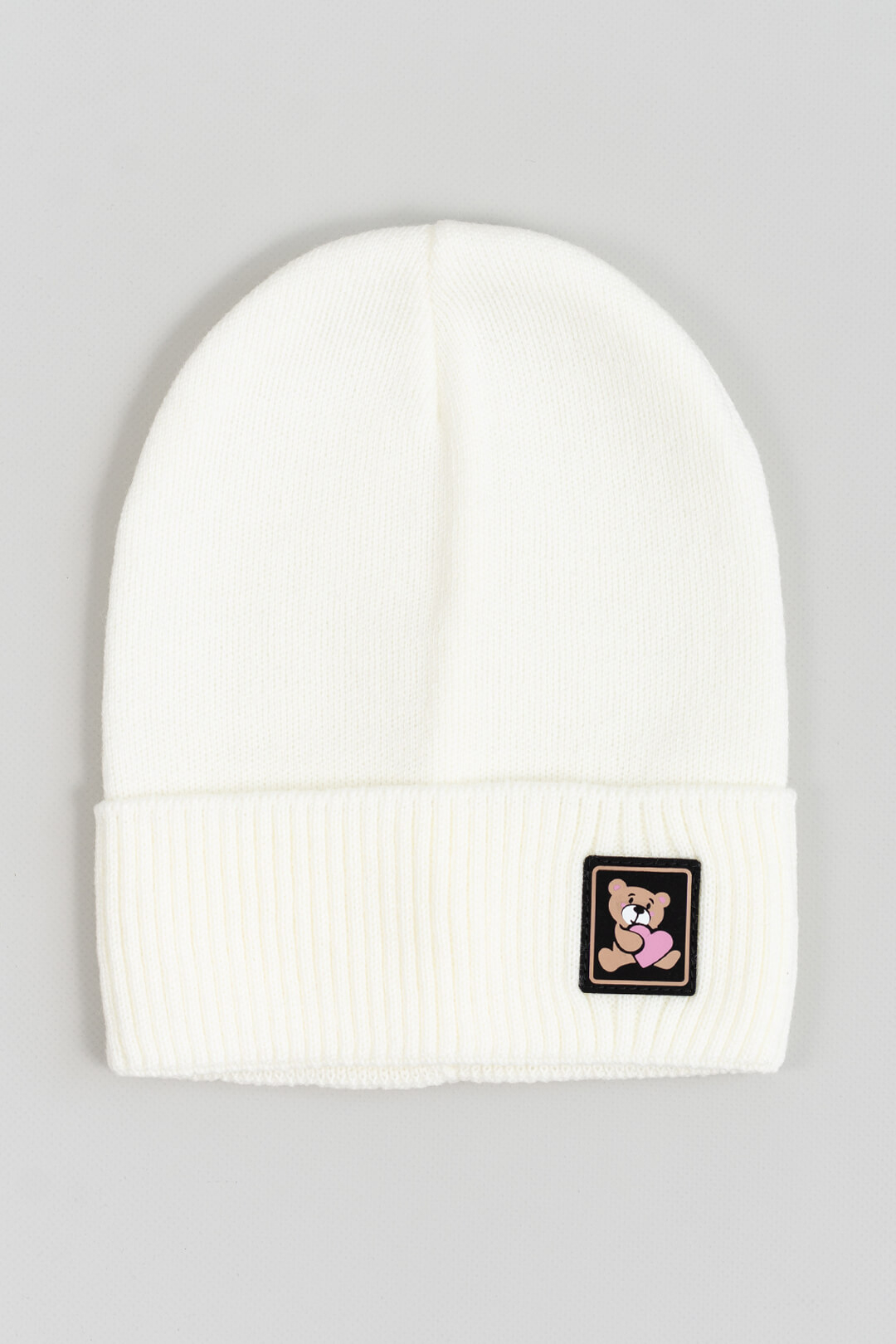 Шапка для дівчинки молочний в'язка